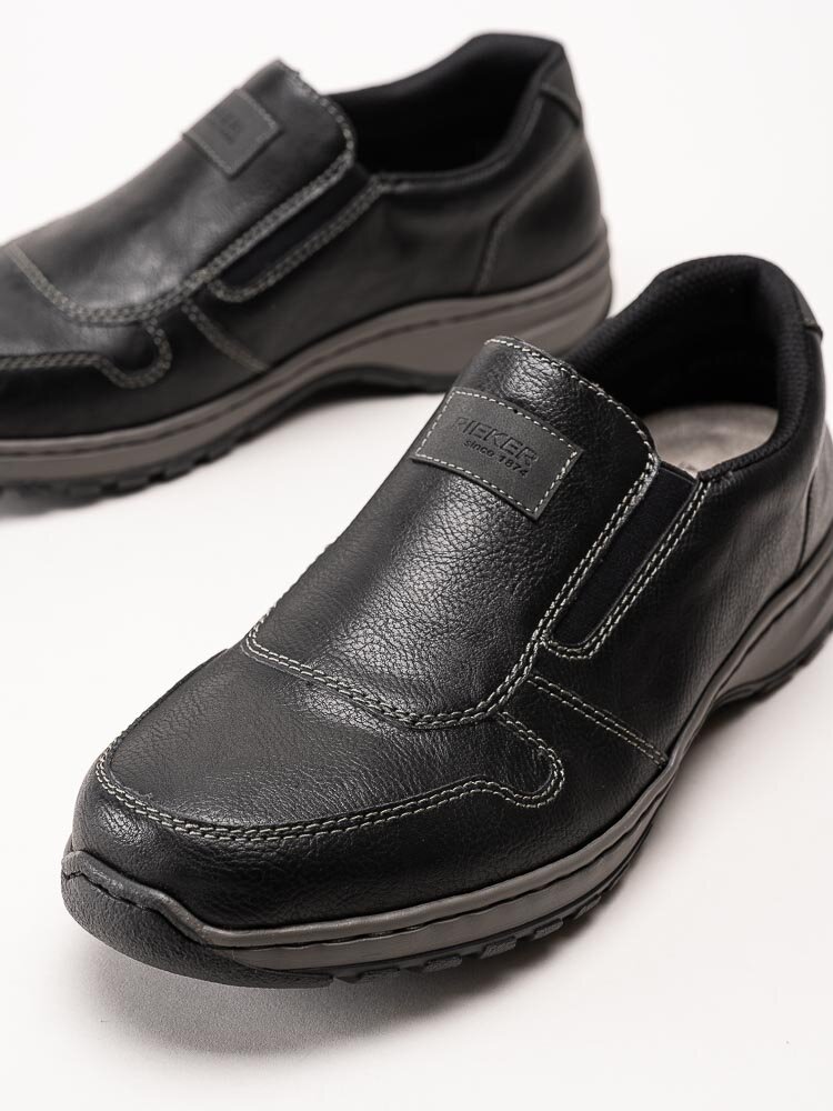 Rieker - Svarta slip on promenadskor